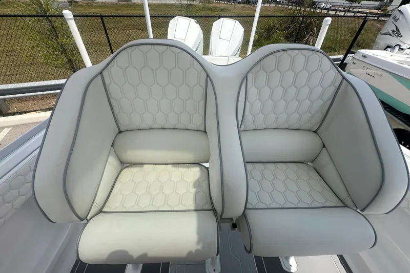 Slide: The Image of 2022 Glasstream 280 Pro-XS boat seats with hexagonal pattern upholstery. - 17