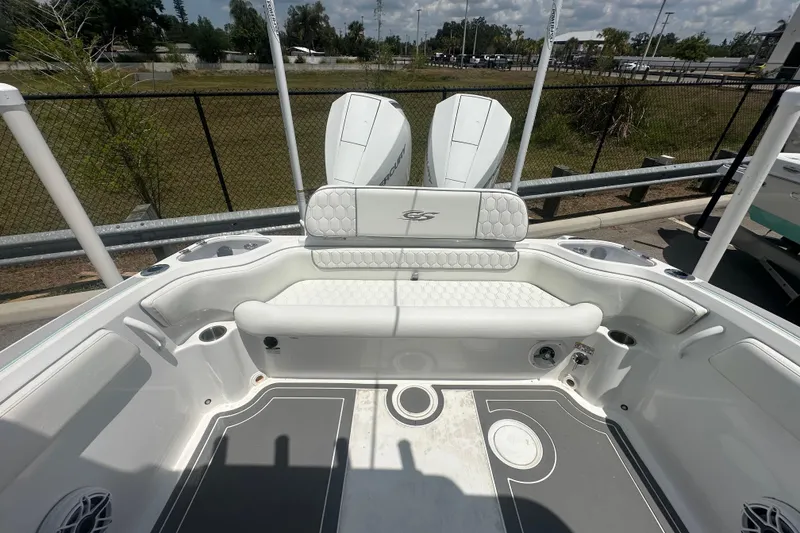 Slide: The Image of 2022 Glasstream 280 Pro-XS boat interior with white seating and dual outboard motors. - 19