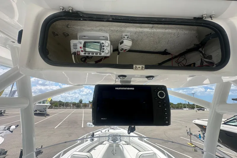 Slide: The Image of 2022 Glasstream 280 Pro-XS boat dashboard with Humminbird electronics and storage compartment. - 20