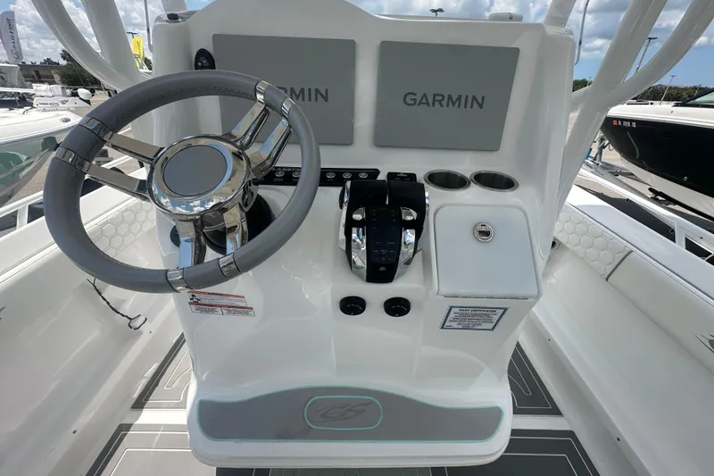 Slide: The Image of 2022 Glasstream 280 Pro-XS boat console with Garmin displays and steering wheel. - 5