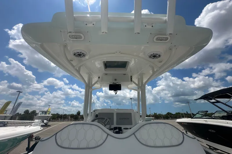 Slide: The Image of 2022 Glasstream 280 Pro-XS boat interior with speakers and clear sky background. - 6