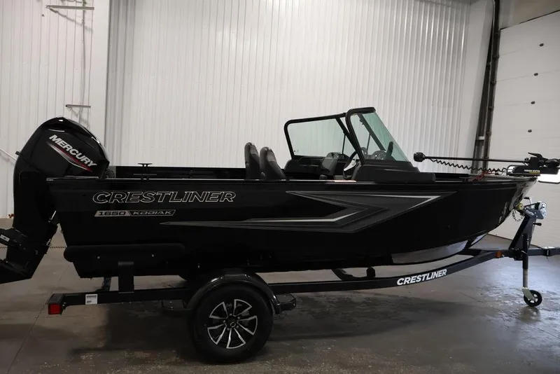 Slide: The Image of 2027 Crestliner 1650 Kodiak WT boat with Mercury engine in a showroom. - 16