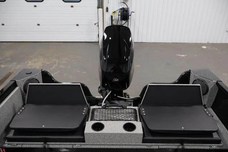 Slide: The Image of 2027 Crestliner 1650 Kodiak WT boat interior with motor and seating. - 50