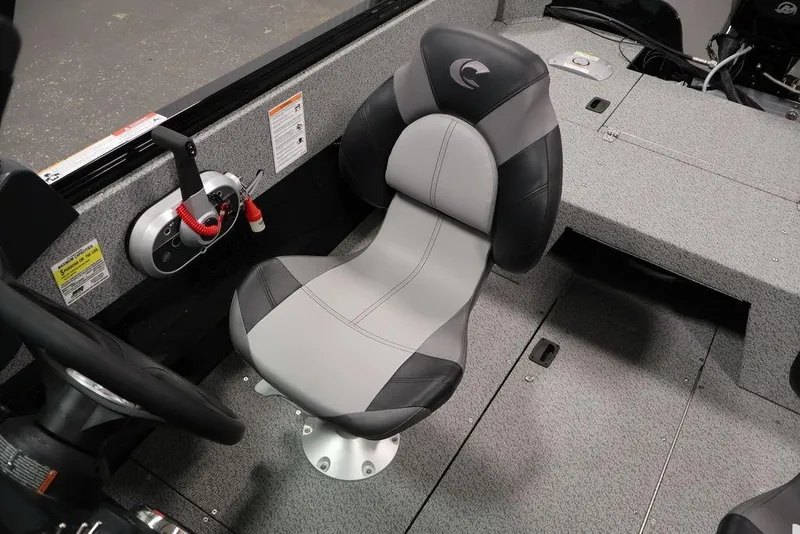 Slide: The Image of 2027 Crestliner 1650 Kodiak WT boat interior with gray and black captain's chair. - 38