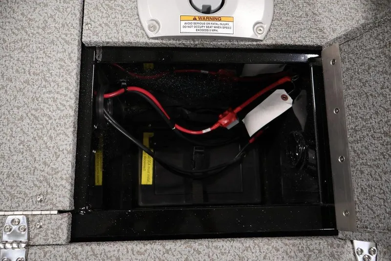 Slide: The Image of Battery compartment of 2027 Crestliner 1650 Kodiak WT boat with wiring and warning label. - 44
