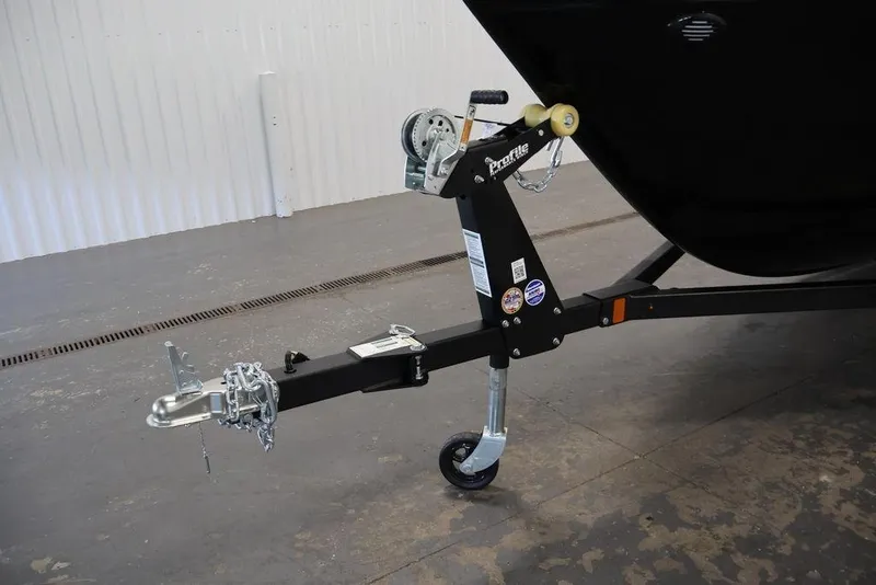 Slide: The Image of Trailer hitch of 2027 Crestliner 1650 Kodiak WT boat, featuring a sturdy wheel and winch. - 57