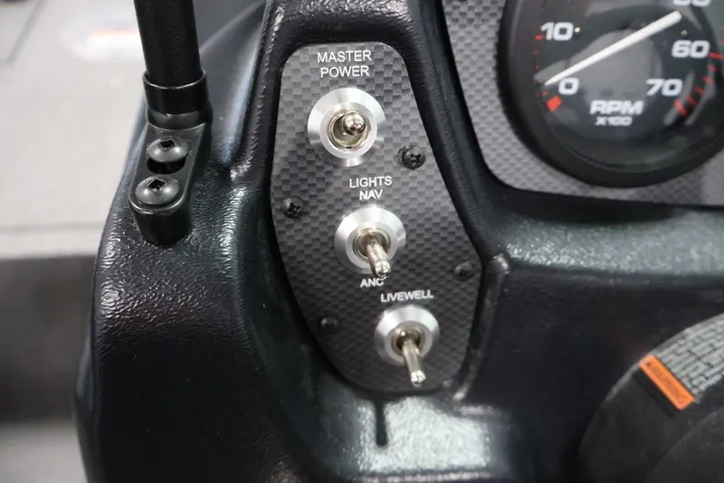 Slide: The Image of Dashboard switches on a 2027 Crestliner 1650 Kodiak WT boat, featuring power and navigation controls. - 37