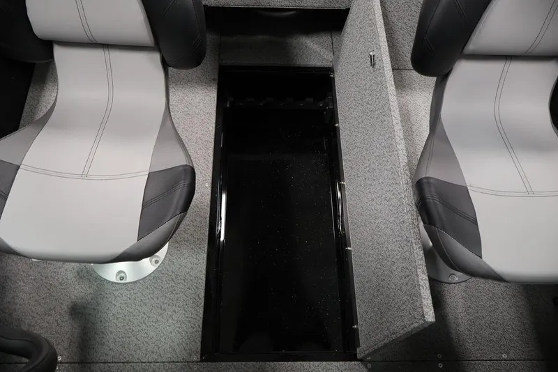 Slide: The Image of 2027 Crestliner 1650 Kodiak WT interior with open storage compartment and two seats. - 43