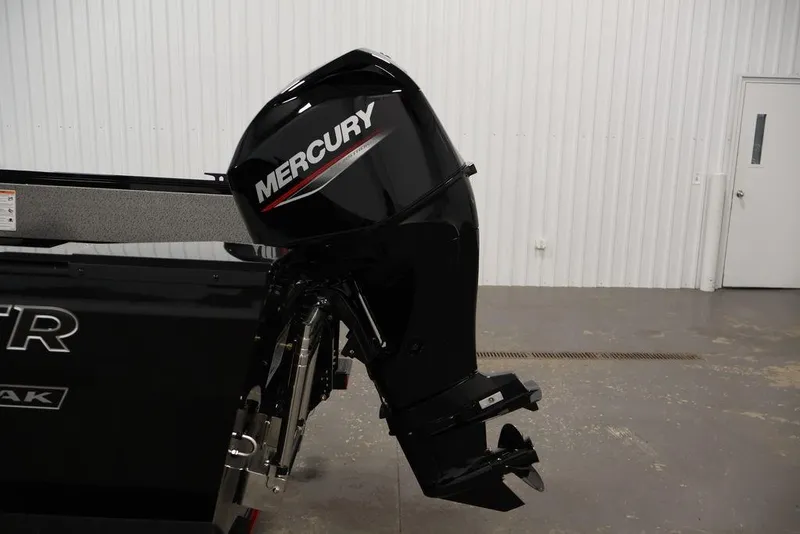 Slide: The Image of 2027 Crestliner 1650 Kodiak WT with Mercury outboard motor in showroom. - 49