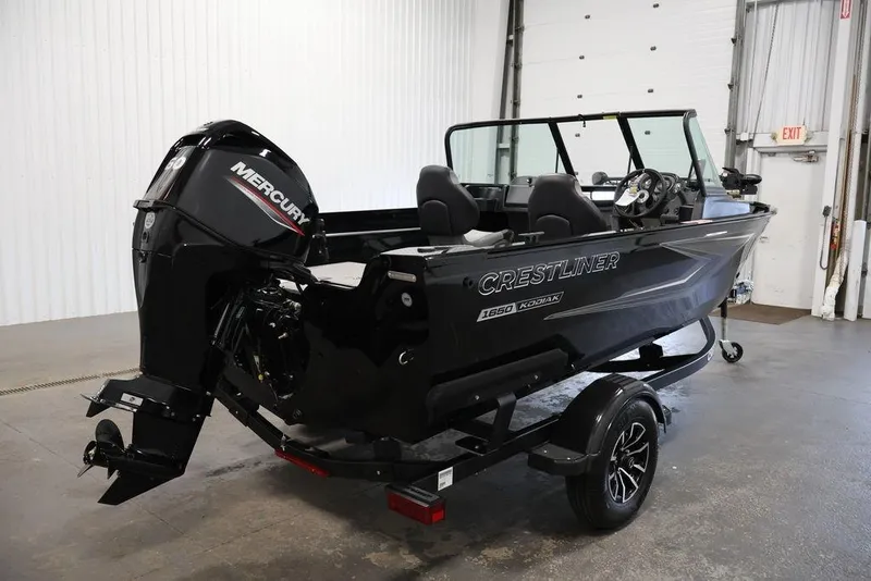 Slide: The Image of 2027 Crestliner 1650 Kodiak WT boat with Mercury engine in a showroom setting. - 17