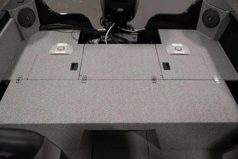 Slide: The Image of 2027 Crestliner 1650 Kodiak WT boat interior with storage compartments and speakers. - 45