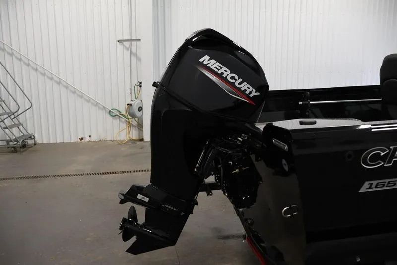 Slide: The Image of 2027 Crestliner 1650 Kodiak WT with Mercury outboard motor in a garage setting. - 55