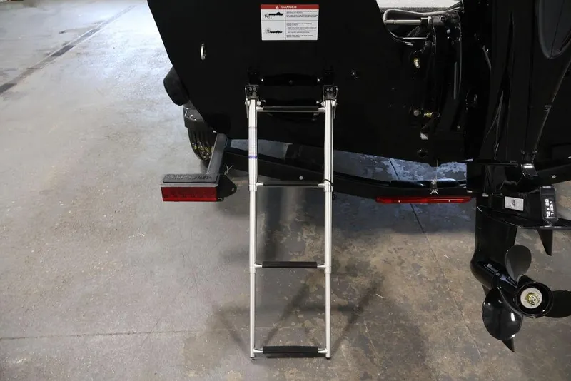 Slide: The Image of Rear view of 2027 Crestliner 1650 Kodiak WT boat with ladder and propeller. - 51