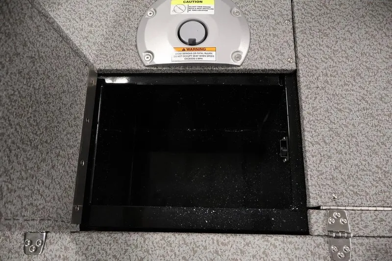 Slide: The Image of Storage compartment in 2027 Crestliner 1650 Kodiak WT boat, featuring secure latch and warning label. - 46