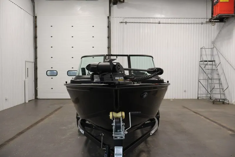 Slide: The Image of 2027 Crestliner 1650 Kodiak WT boat in indoor storage facility. - 14