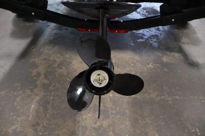 Slide: The Image of 2027 Crestliner 1650 Kodiak WT boat propeller on concrete floor. - 54