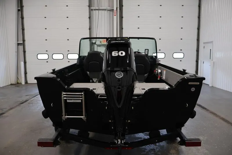Slide: The Image of 2027 Crestliner 1650 Kodiak WT boat with Mercury 60 engine in a garage. - 19
