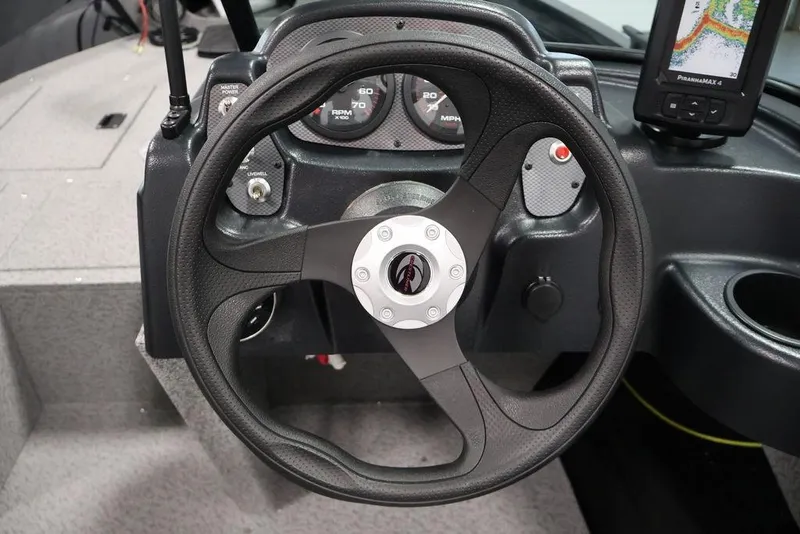 Slide: The Image of Steering wheel and dashboard of 2027 Crestliner 1650 Kodiak WT boat with gauges and fish finder. - 25