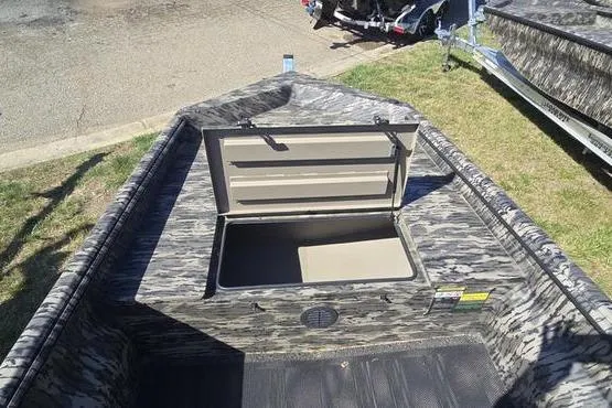 Slide: The Image of Camouflage-patterned 2026 Havoc 1553 VJST boat with open storage compartment. - 8