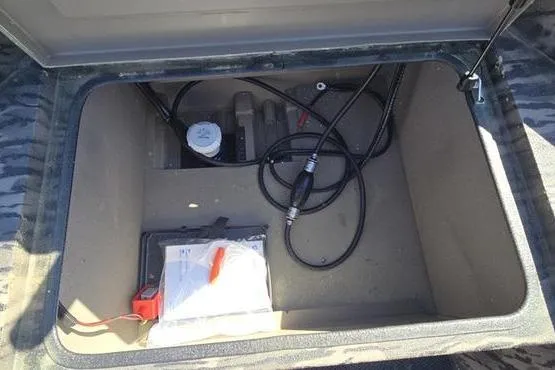 Slide: The Image of Open storage compartment of 2026 Havoc 1553 VJST with cables and accessories. - 9