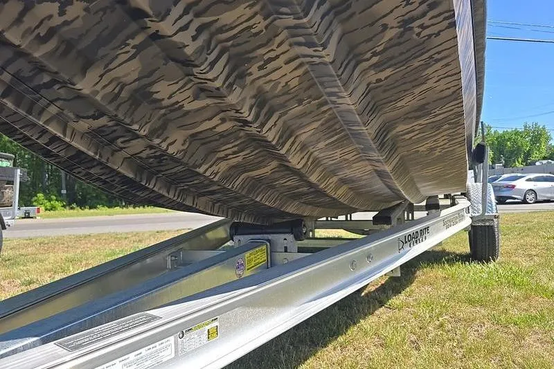 Slide: The Image of 2026 Havoc 1760 VJST boat on trailer, showcasing camo-patterned hull design. - 5
