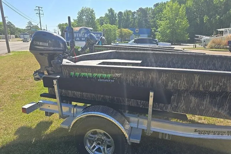 Slide: The Image of 2026 Havoc 1760 VJST boat on trailer with Yamaha motor, parked outdoors. - 6