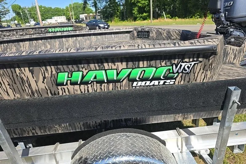 Slide: The Image of 2026 Havoc 1760 VJST boat with camouflage design on a trailer. - 7