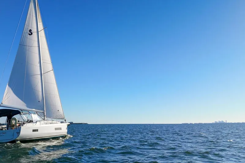 Slide: The Image of 2022 Beneteau Oceanis 40.1 sailing on open sea under clear blue sky. - 126