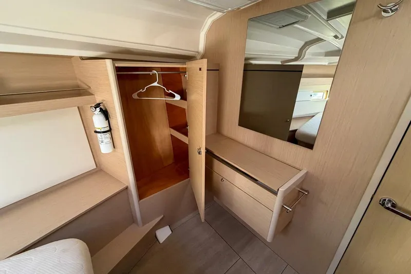 Slide: The Image of Interior of 2022 Beneteau Oceanis 40.1 yacht with wardrobe and mirror. - 13
