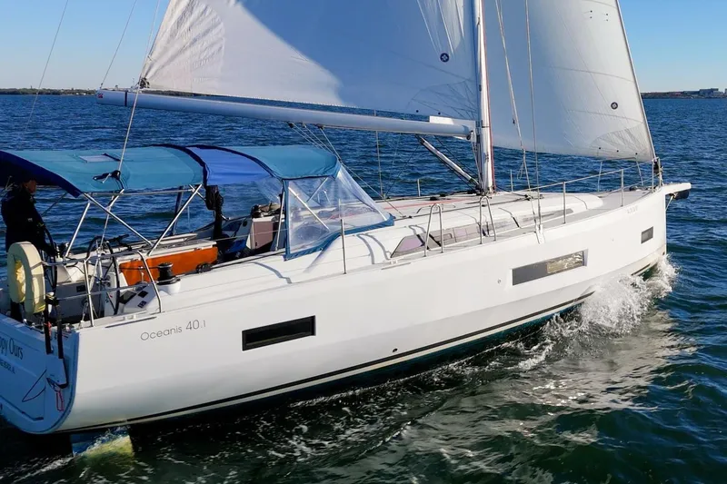 Slide: The Image of 2022 Beneteau Oceanis 40.1 sailing on open water with blue canopy. - 132