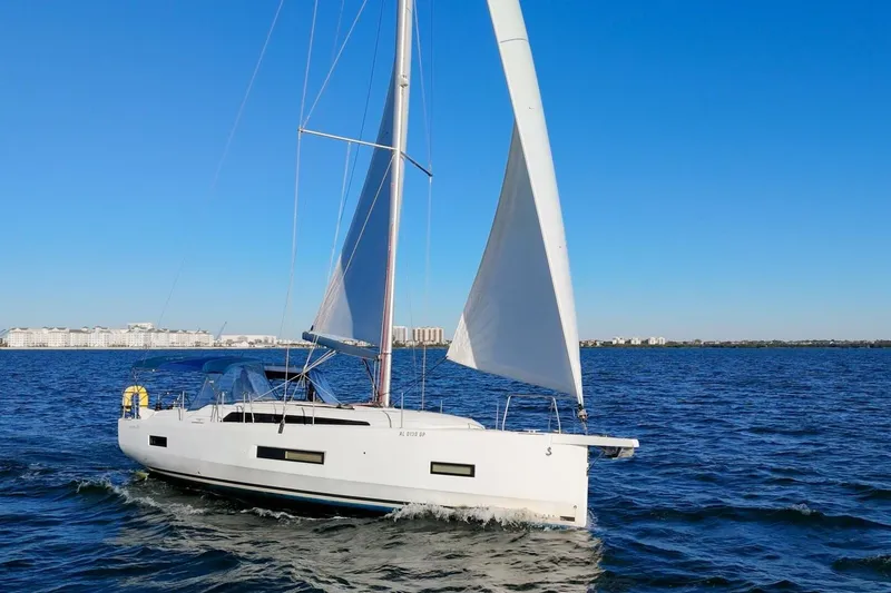 Slide: The Image of 2022 Beneteau Oceanis 40.1 sailing on open water under clear blue sky. - 134