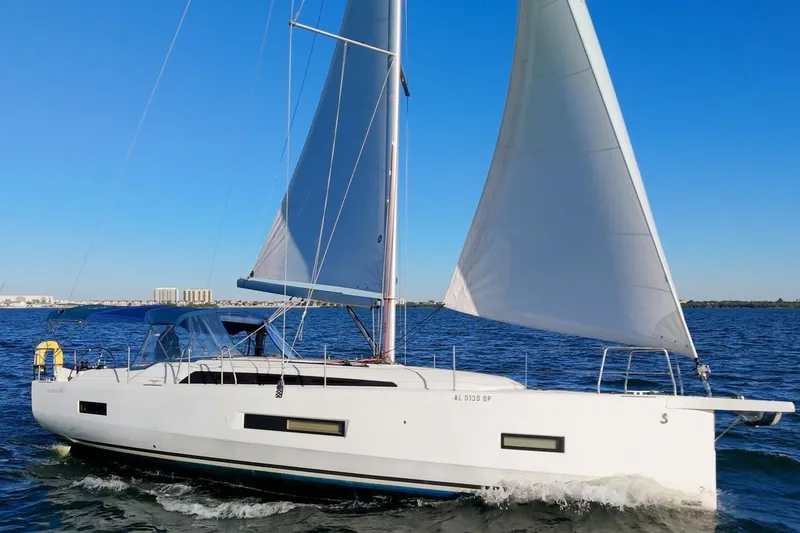 Slide: The Image of 2022 Beneteau Oceanis 40.1 sailing on open water under clear blue skies. - 135