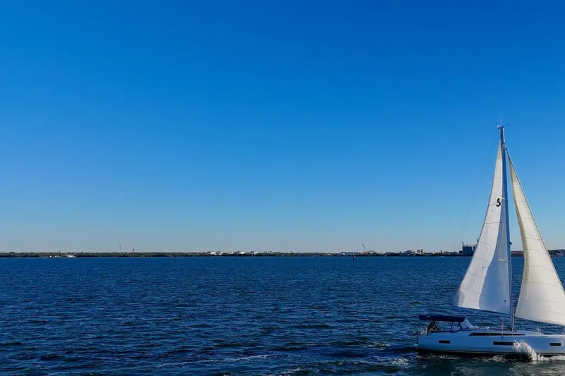 Slide: The Image of Sailboat Beneteau Oceanis 40.1, 2022 model, cruising on a clear blue sea. - 137