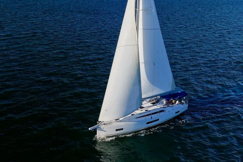 Slide: The Image of 2022 Beneteau Oceanis 40.1 sailing on open water, showcasing elegant design and performance. - 142