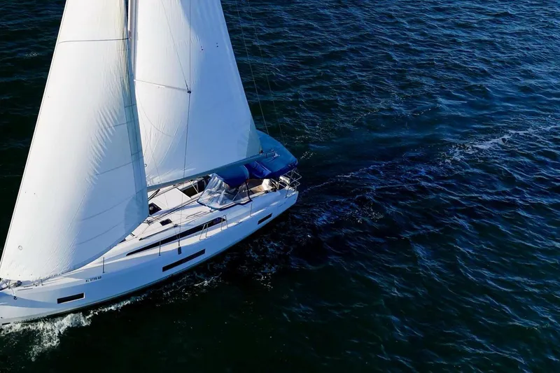 Slide: The Image of 2022 Beneteau Oceanis 40.1 sailing on open water, showcasing elegant design and performance. - 143