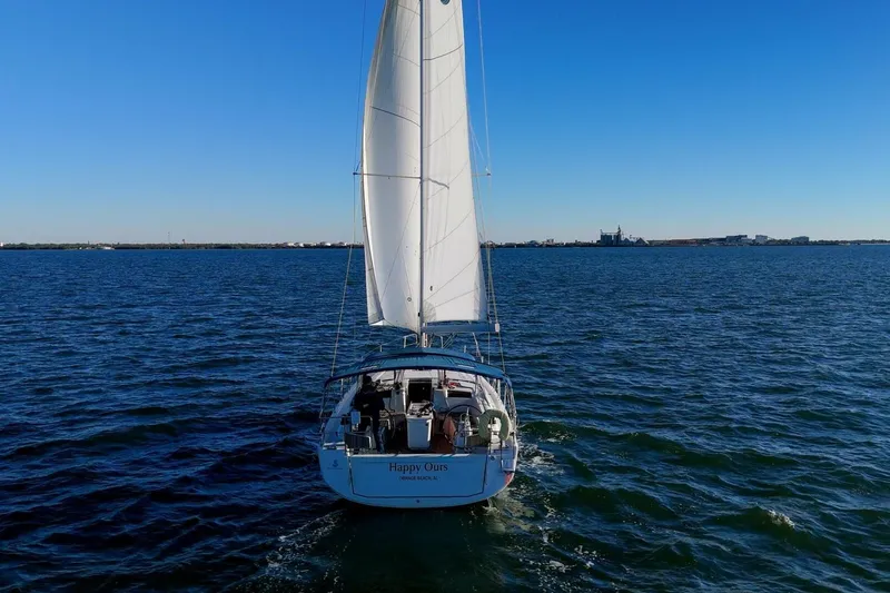 Slide: The Image of 2022 Beneteau Oceanis 40.1 sailing on open water under clear blue skies. - 148