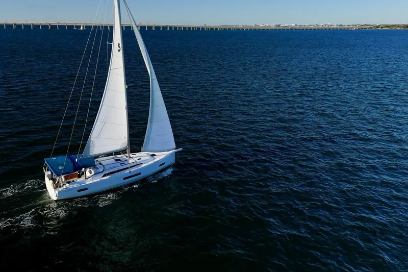 Slide: The Image of 2022 Beneteau Oceanis 40.1 sailing on open sea under clear blue sky. - 160