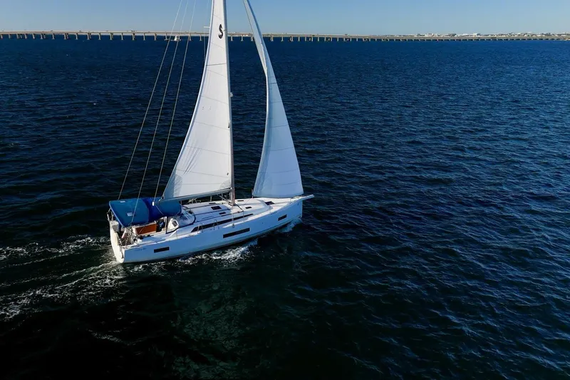 Slide: The Image of 2022 Beneteau Oceanis 40.1 sailing on open water under clear blue skies. - 161