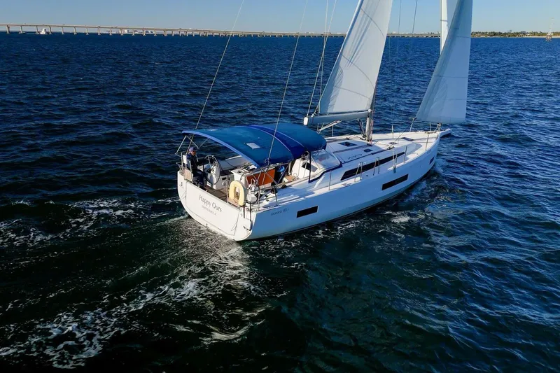 Slide: The Image of 2022 Beneteau Oceanis 40.1 sailing on open water under clear blue skies. - 163
