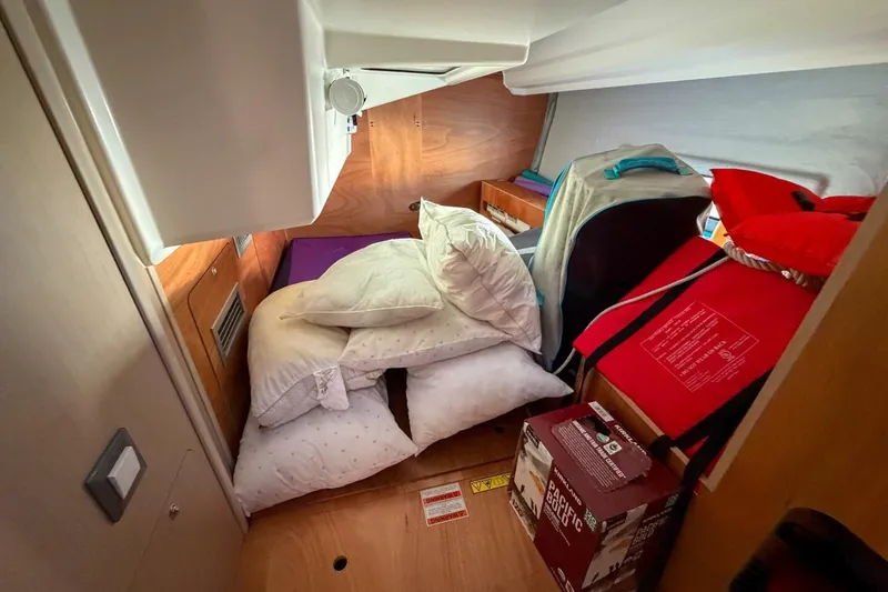 Slide: The Image of Interior cabin of 2022 Beneteau Oceanis 40.1 yacht with pillows and storage items. - 25