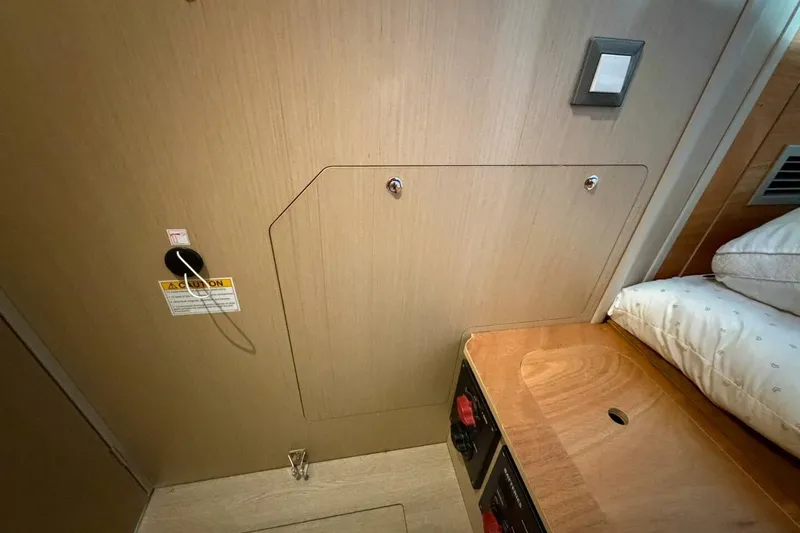 Slide: The Image of Interior of 2022 Beneteau Oceanis 40.1 yacht cabin with wooden paneling and bed. - 26