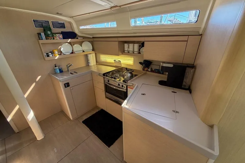 Slide: The Image of Modern kitchen interior of 2022 Beneteau Oceanis 40.1 yacht with stove and sink. - 33