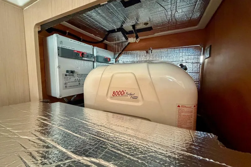 Slide: The Image of Engine compartment of 2022 Beneteau Oceanis 40.1 yacht with generator and insulation. - 43