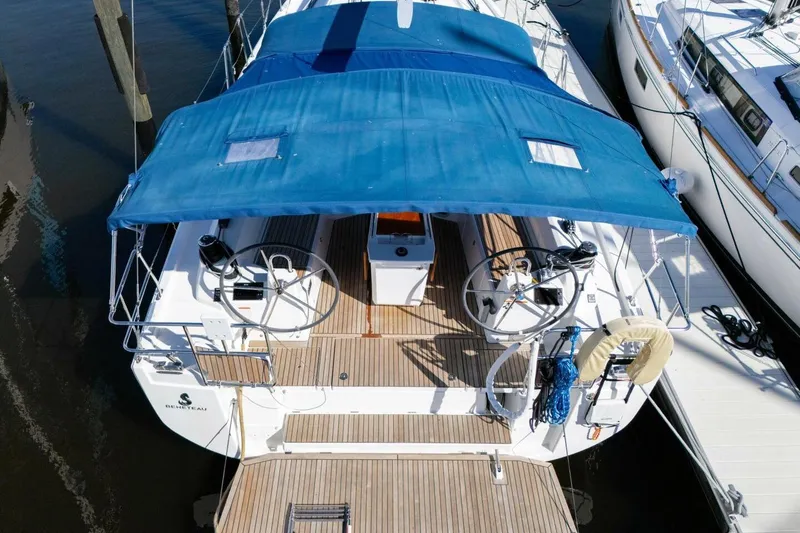 Slide: The Image of 2022 Beneteau Oceanis 40.1 sailboat with blue canopy, docked at marina. - 45