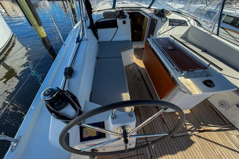 Slide: The Image of 2022 Beneteau Oceanis 40.1 yacht cockpit with steering wheel and navigation equipment. - 54