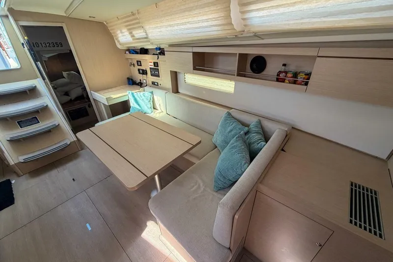 Slide: The Image of Interior of 2022 Beneteau Oceanis 40.1 yacht, featuring modern seating and dining area. - 6