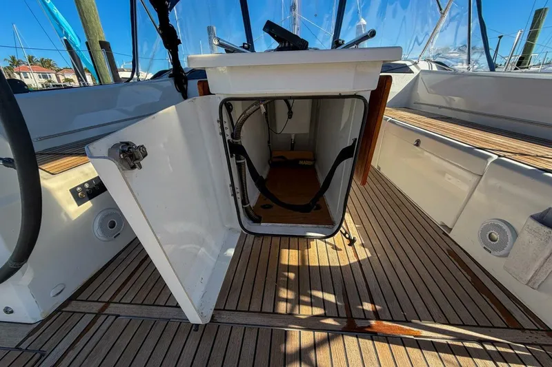 Slide: The Image of Beneteau Oceanis 40.1 cockpit with open storage compartment, 2022 model. - 60