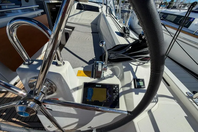 Slide: The Image of Cockpit view of 2022 Beneteau Oceanis 40.1 sailboat with steering wheel and navigation equipment. - 65