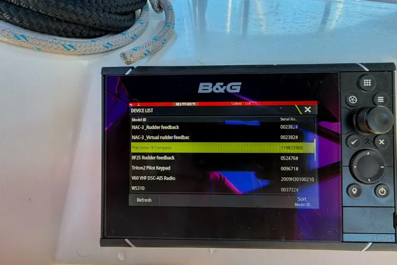 Slide: The Image of B&G navigation display on 2022 Beneteau Oceanis 40.1 sailboat, showing device list and controls. - 70