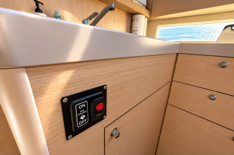 Slide: The Image of Interior of 2022 Beneteau Oceanis 40.1 yacht kitchen with gas control switch. - 16
